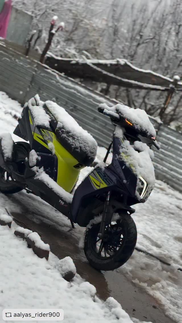 Snow settles in. One machine still owns the frame.